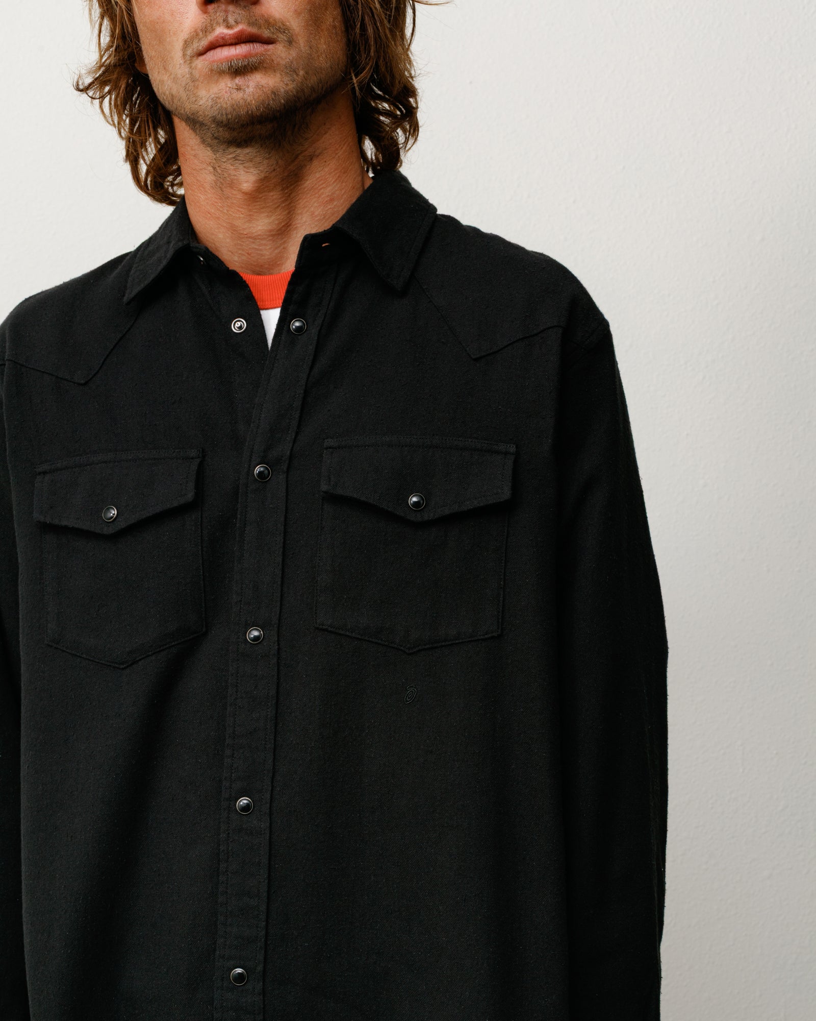 Black cotton-silk western long-sleeve shirt with snap front and dual chest flap pockets on model