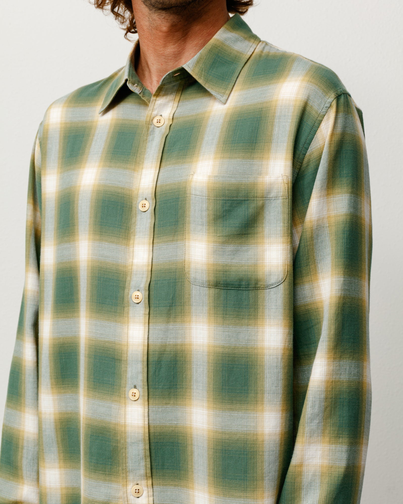 Green ombre plaid long-sleeve shirt with button front and chest pocket