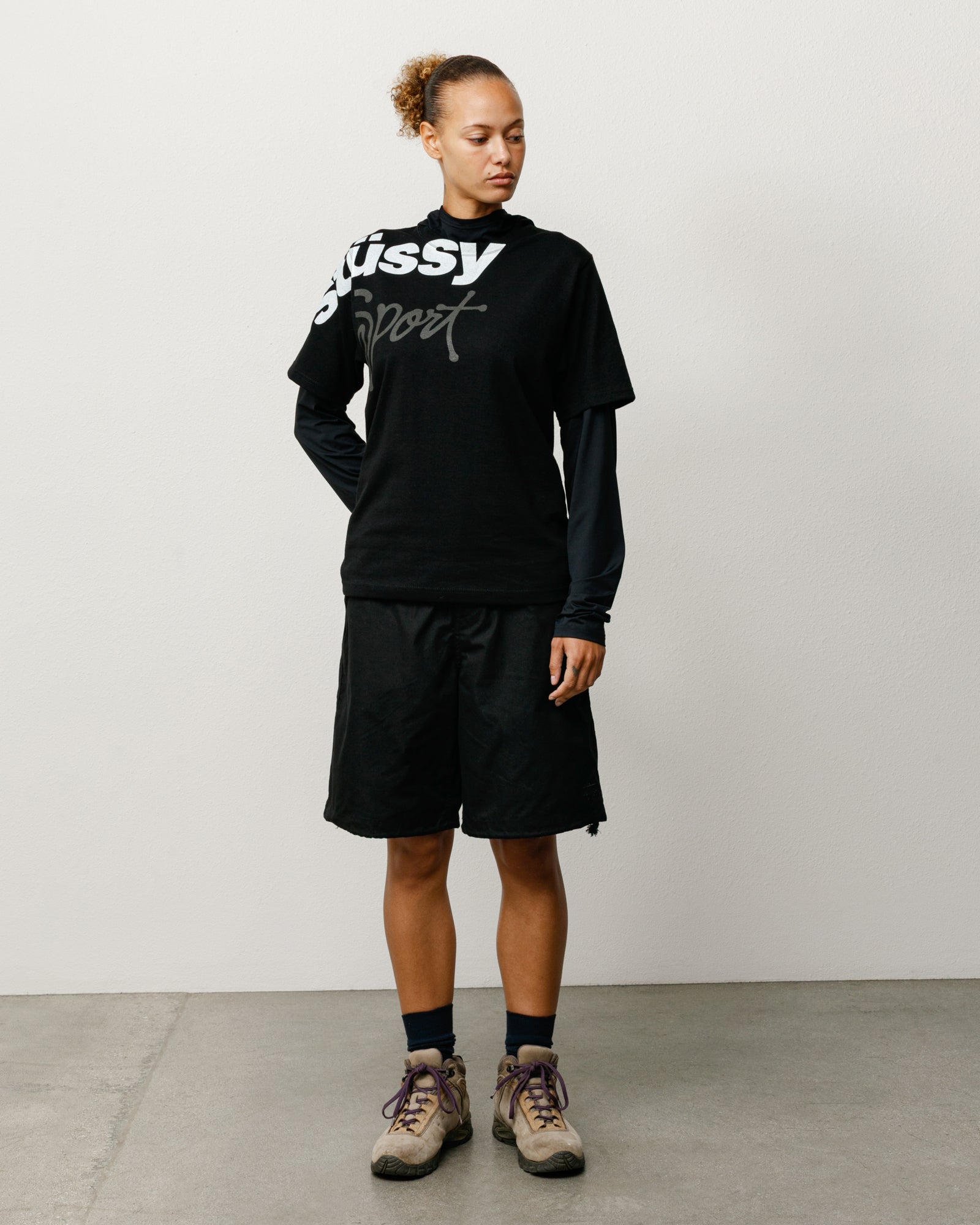 Black baggy cotton-nylon shorts with drawcord waist, shown on model.