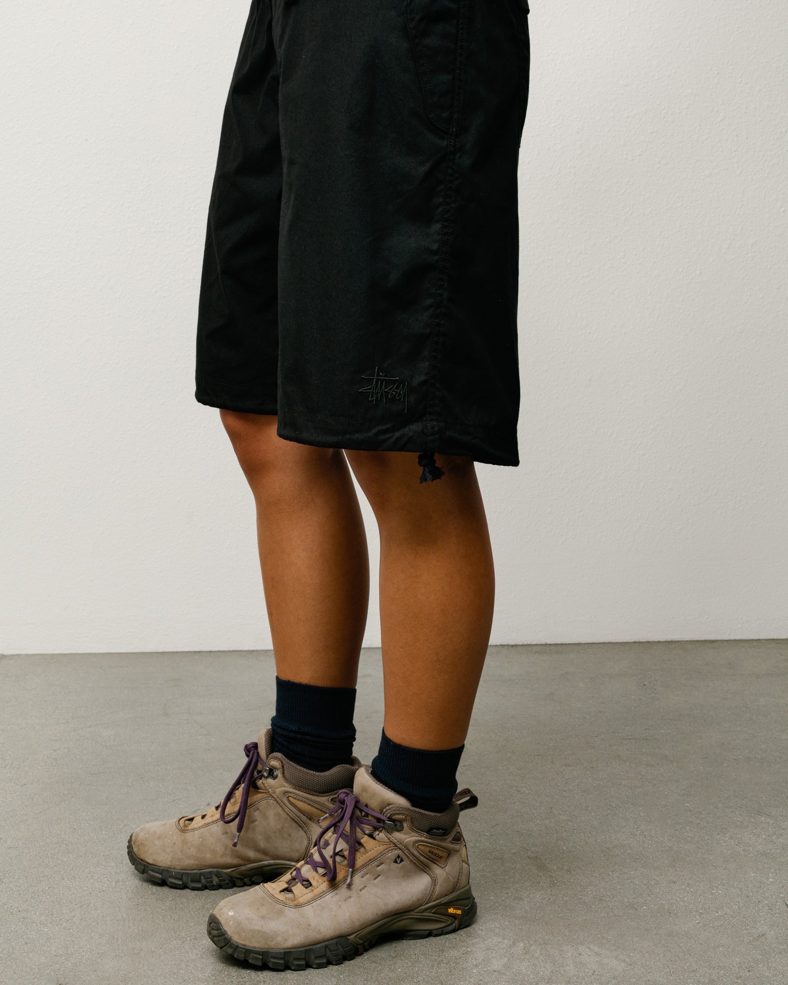 Surplus Short Unisex Regular in Black, knee-length with Stüssy logo embroidery at hem