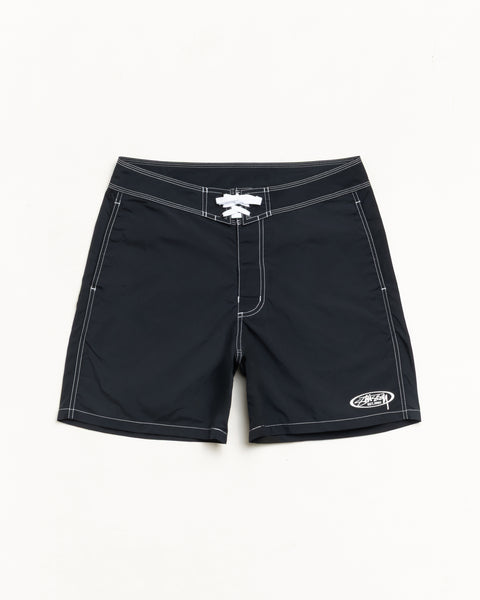 Black board shorts with contrast white stitching, lace-up waist and small logo at hem