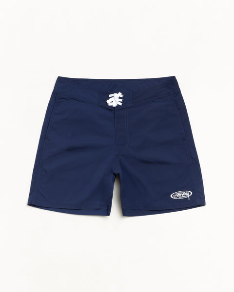 Blue board short with white drawcord and logo at left hem