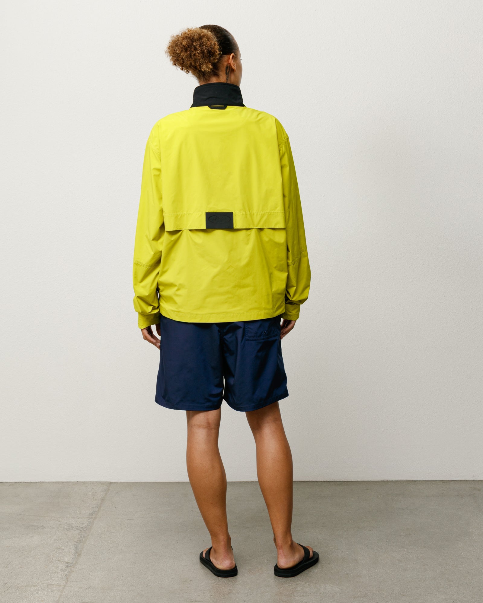Blue Board Short Unisex, Rear View On Model Showing Back Patch Pocket