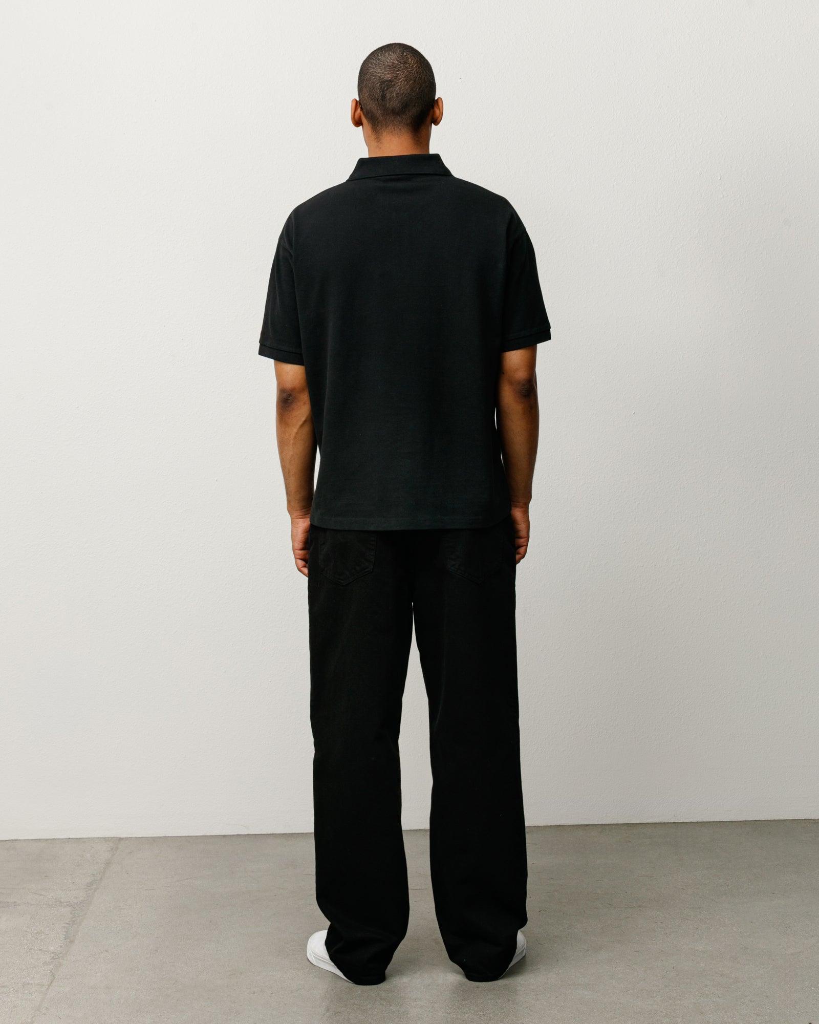 Unisex Short Sleeve Pique Polo Shirt In Black With Rib Collar And Two-Button Placket