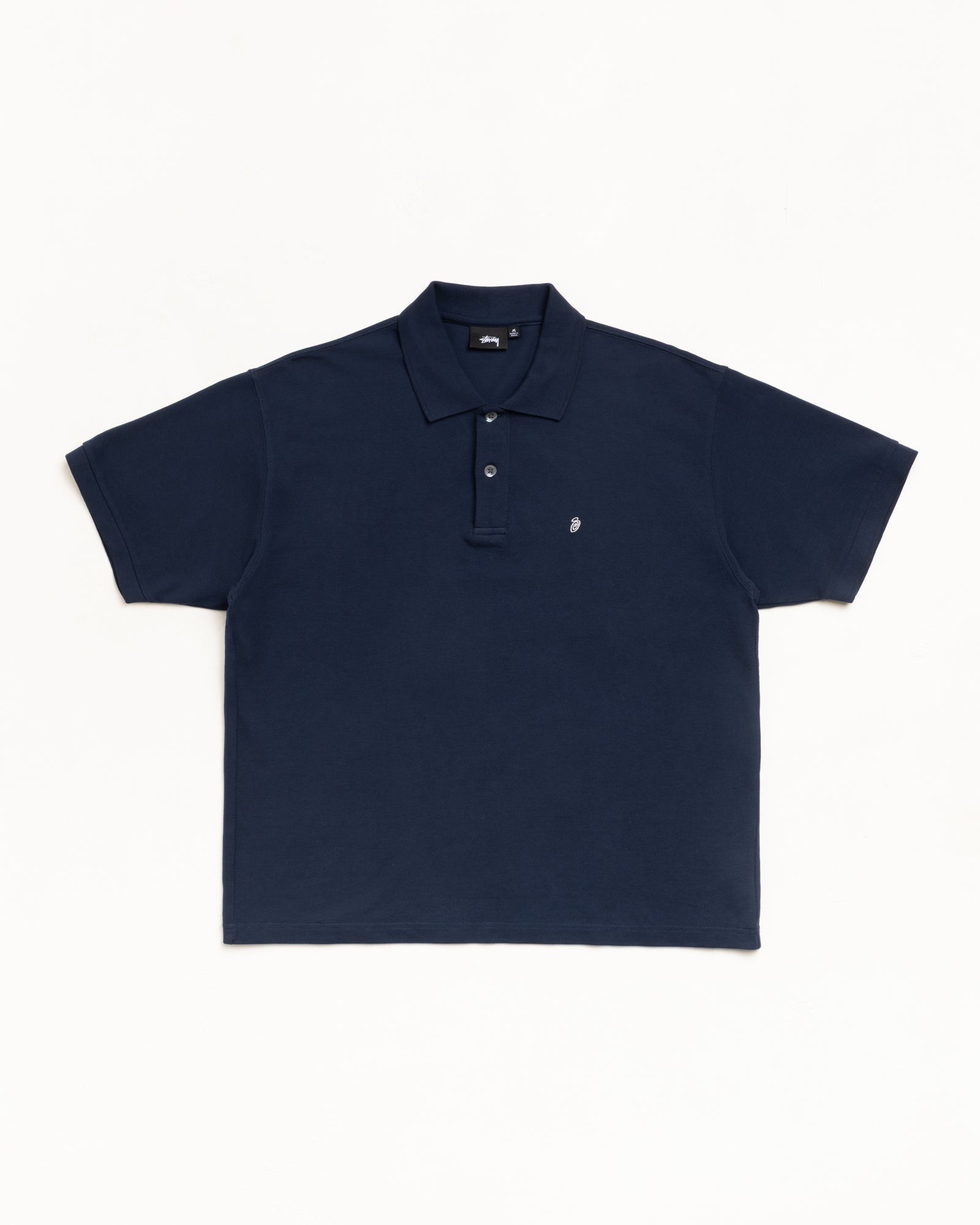 Navy pique short-sleeve polo with ribbed collar, button placket and small chest logo