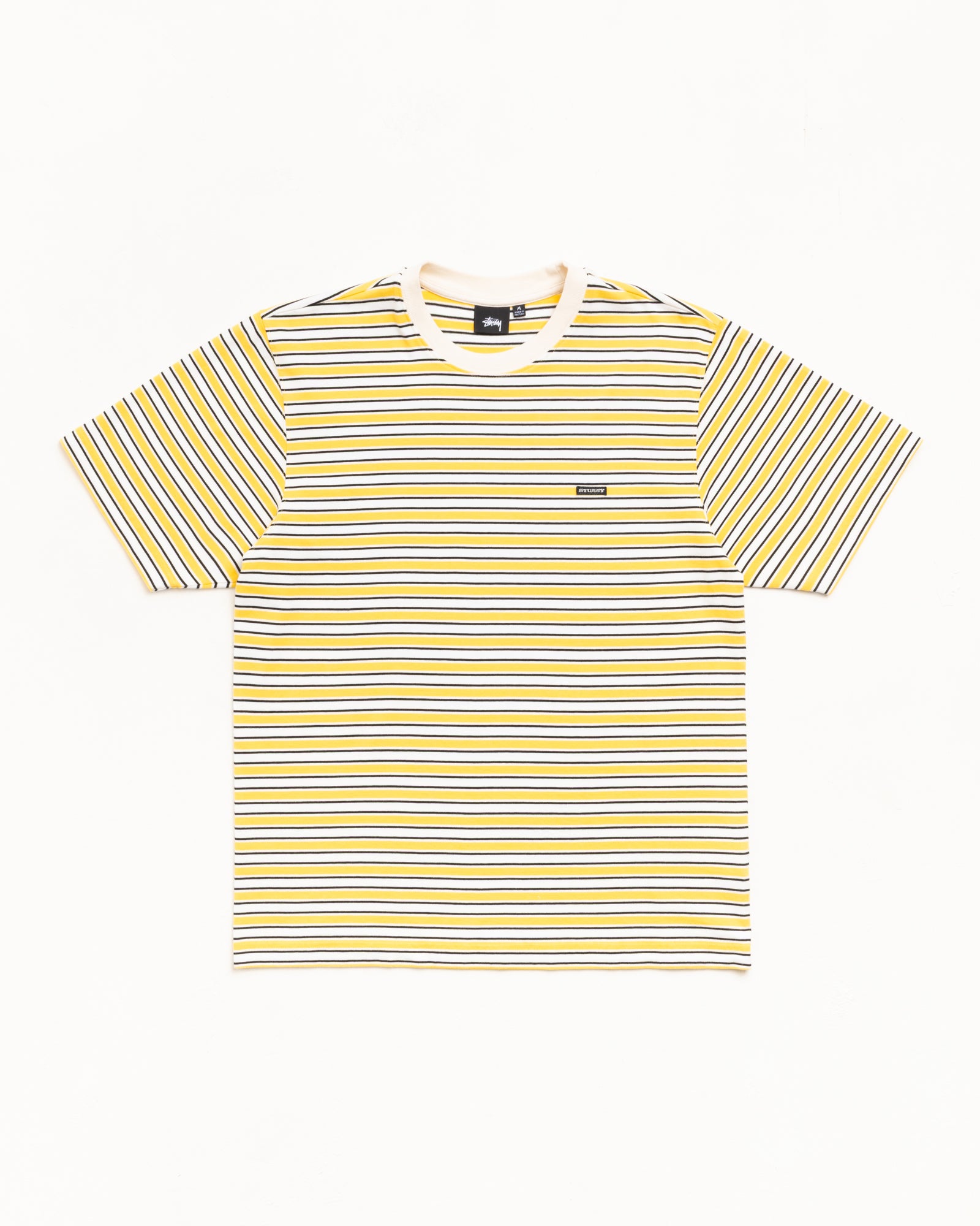 Yellow striped short sleeve tee with ribbed crewneck and small chest logo patch, unisex.