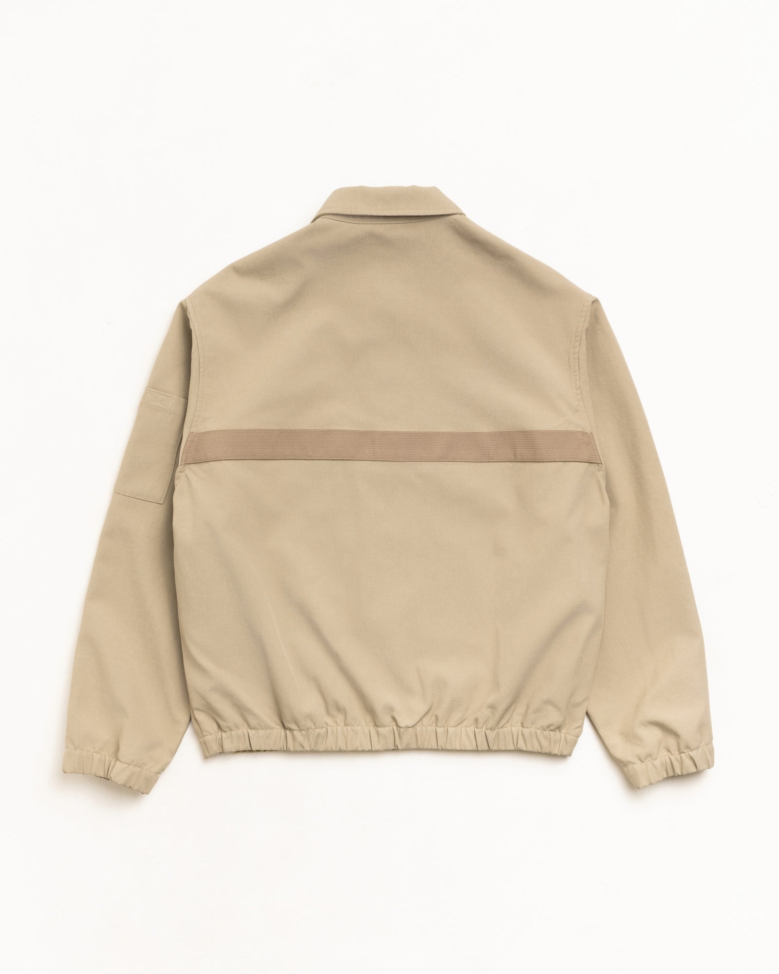 Khaki mechanic jacket, back view with tonal webbing strip and elastic hem.