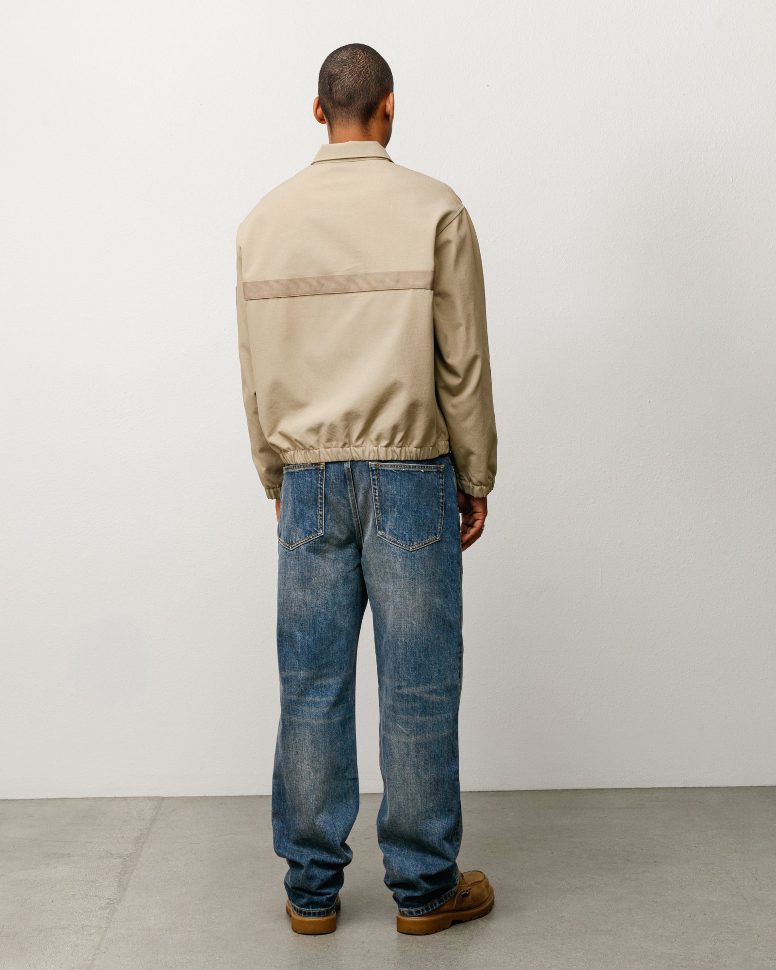 Mechanic Jacket Unisex Long Sleeve In Khaki, back view with horizontal webbing stripe and elastic hem