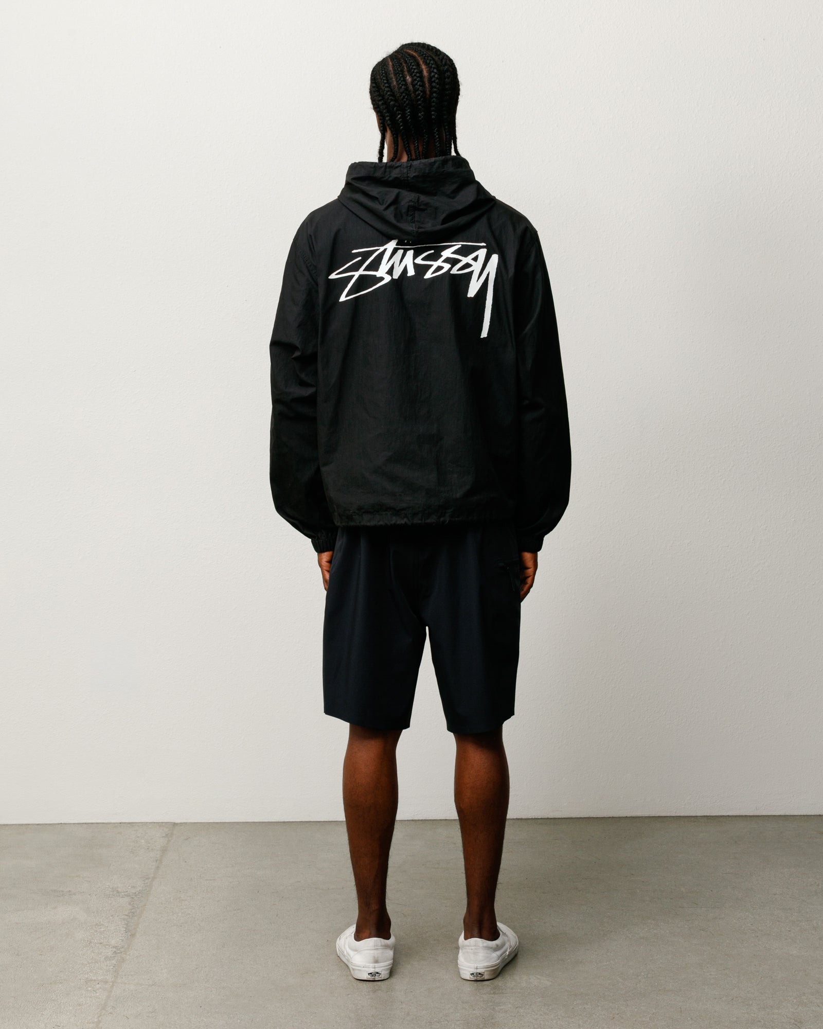 Veste Beach Shell en coton ciré noir, à capuche, unisexe, par Stüssy