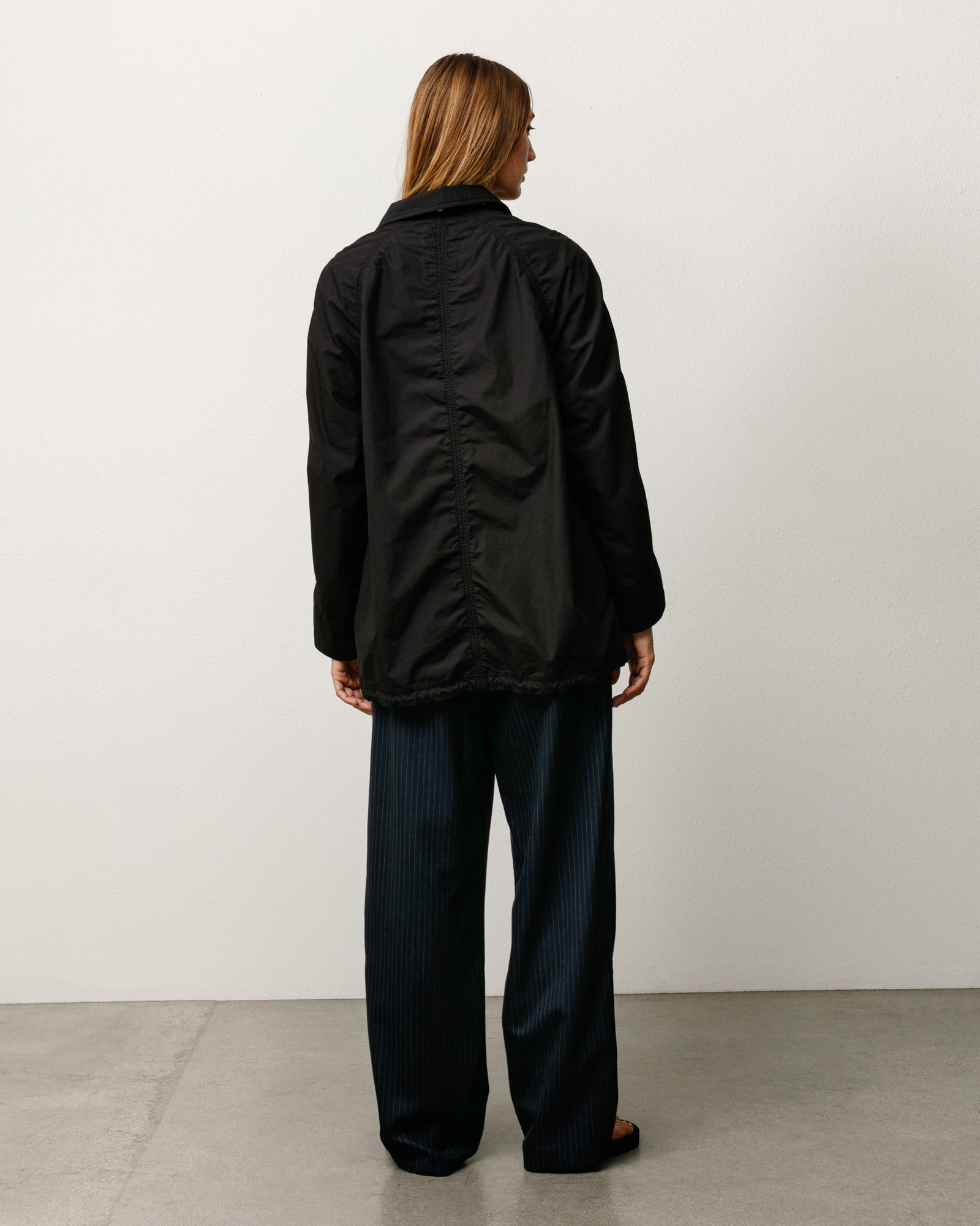 Manteau long léger unisexe noir à manches longues par Stüssy