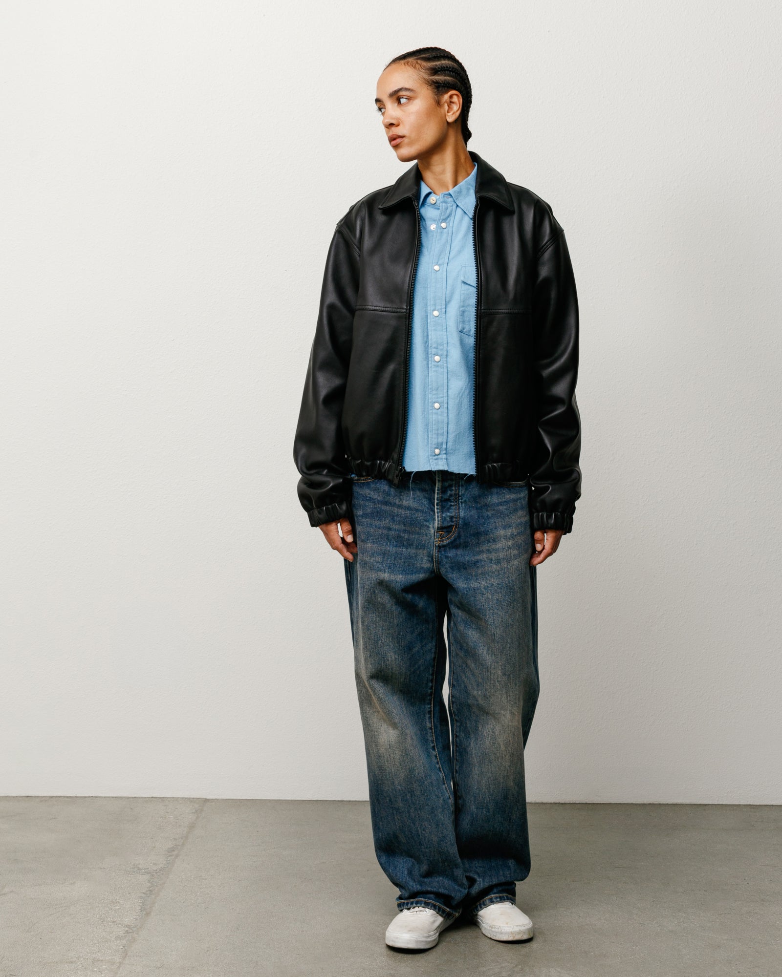 Blue slub denim jeans with relaxed rise and baggy tapered leg, five-pocket design