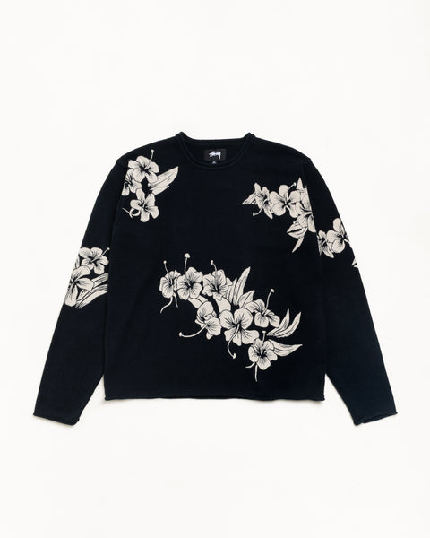 Black long-sleeve knit sweater with white floral pattern