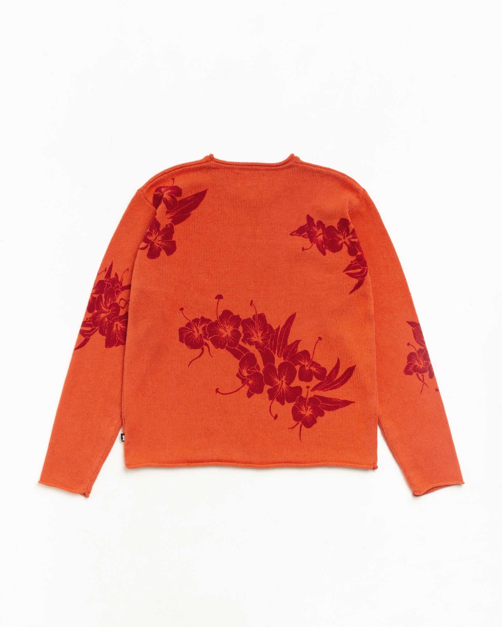 Rust floral roll neck sweater back flat lay, red jacquard knit with rolled edges.