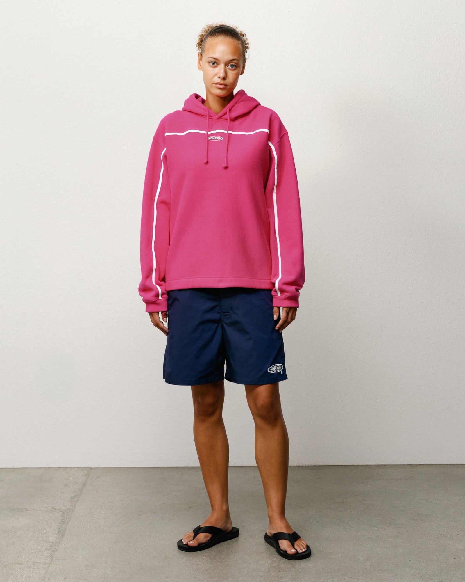 Pink unisex pullover hoodie featuring white piping, drawcord hood and ribbed cuffs