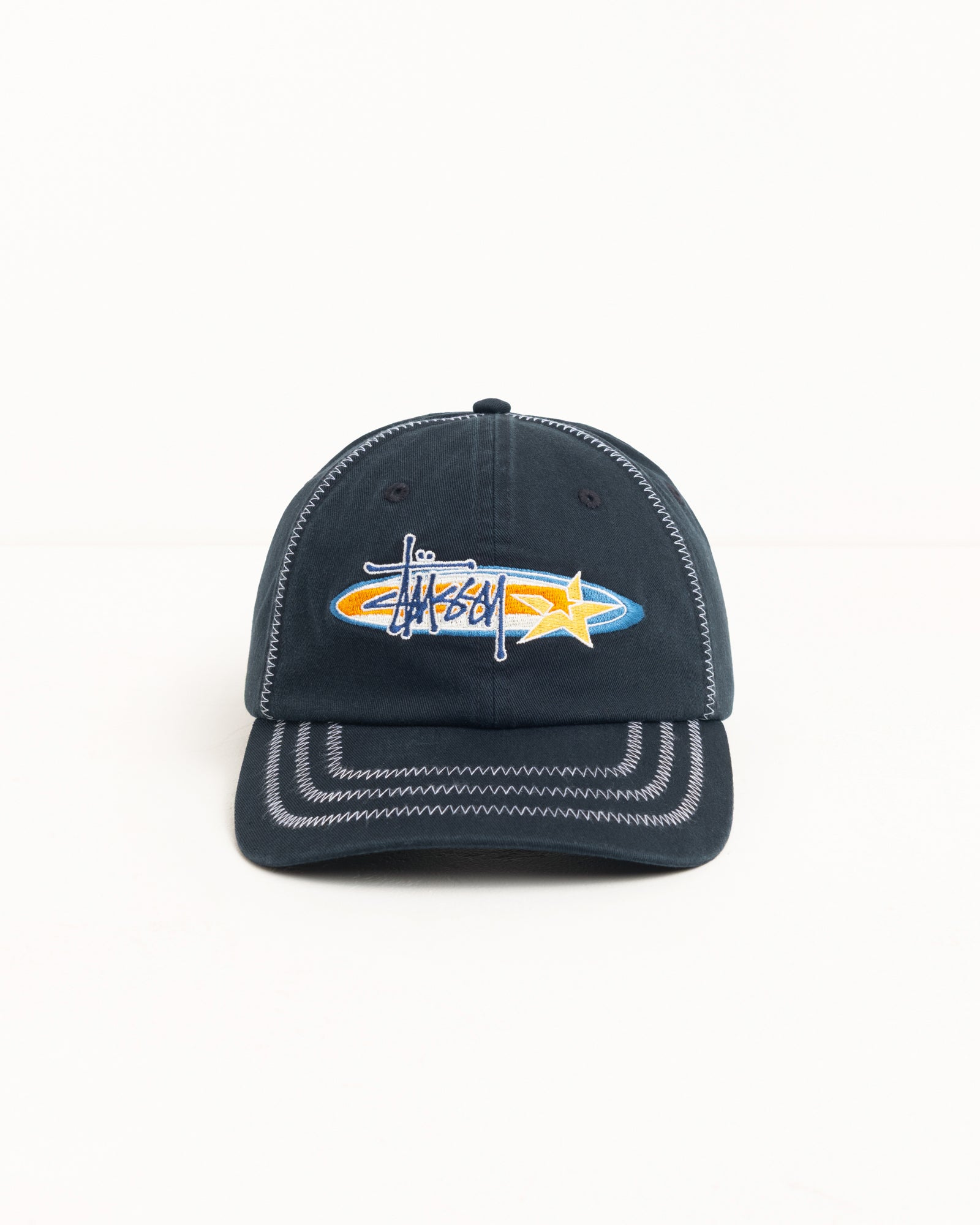 Black cotton twill low-profile cap with oval star embroidery and contrast zig-zag stitching