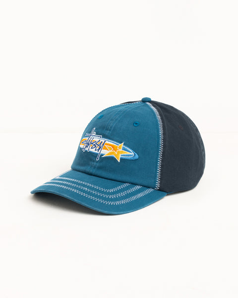 Blue low-profile cap with star logo embroidery and contrast zig-zag stitching