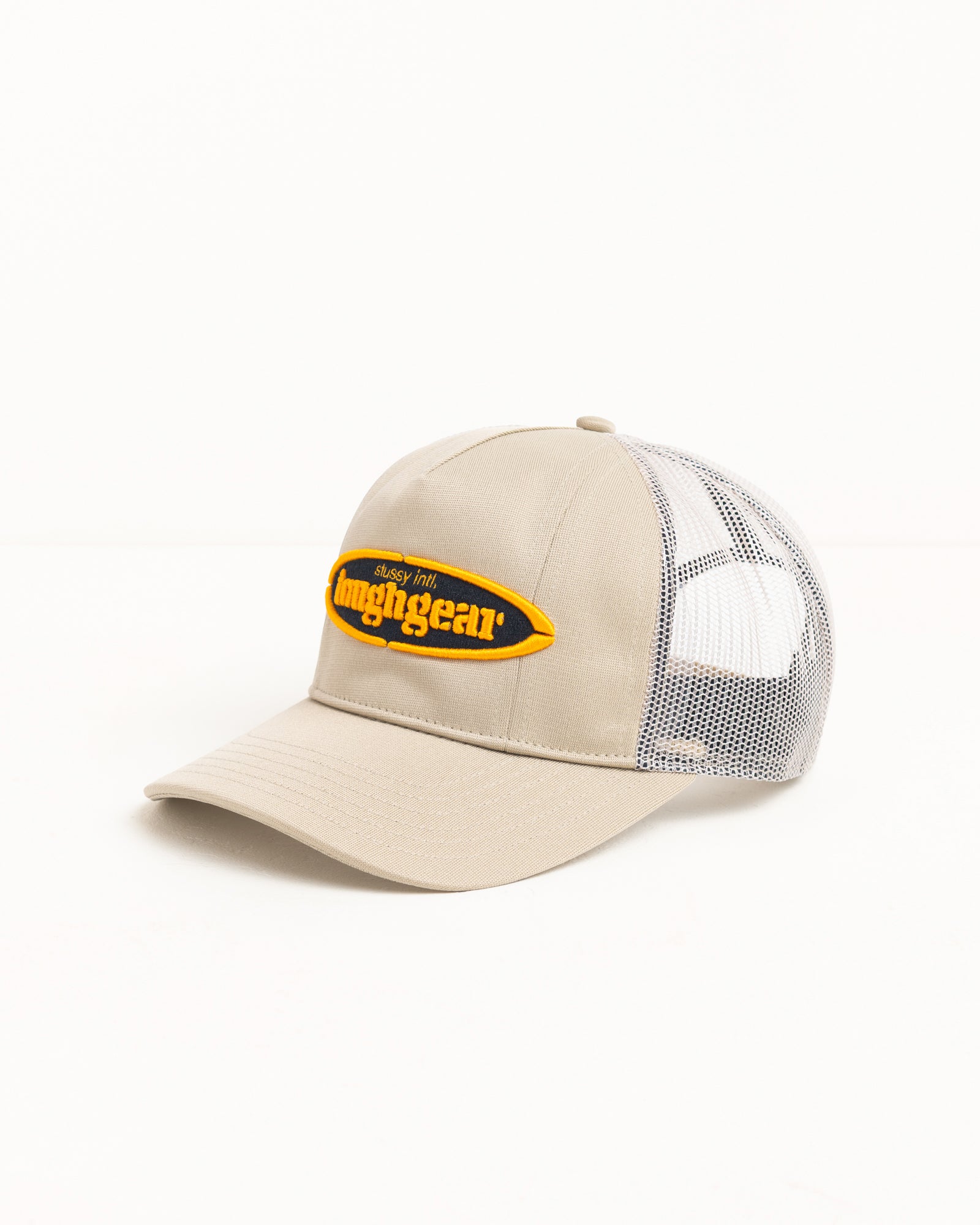 Khaki trucker cap with mesh back and yellow logo patch, unstructured crown, precurved brim