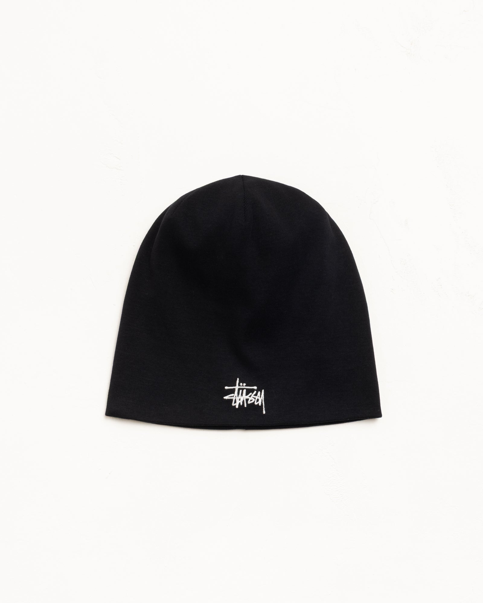 Black jersey skullcap beanie with white logo embroidery at front