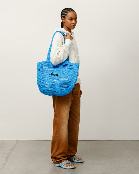 Woven Tote Bag Accessories in the color Blue, handmade from raffia with a Stüssy stock logo