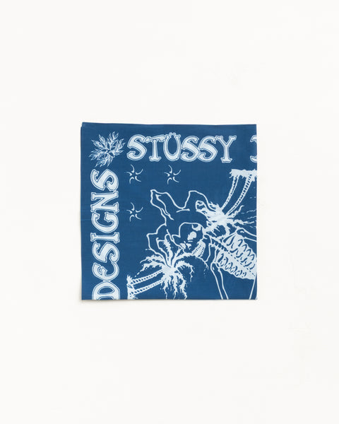 Blue bandana with white graphic artwork and bold lettering, flat-lay view
