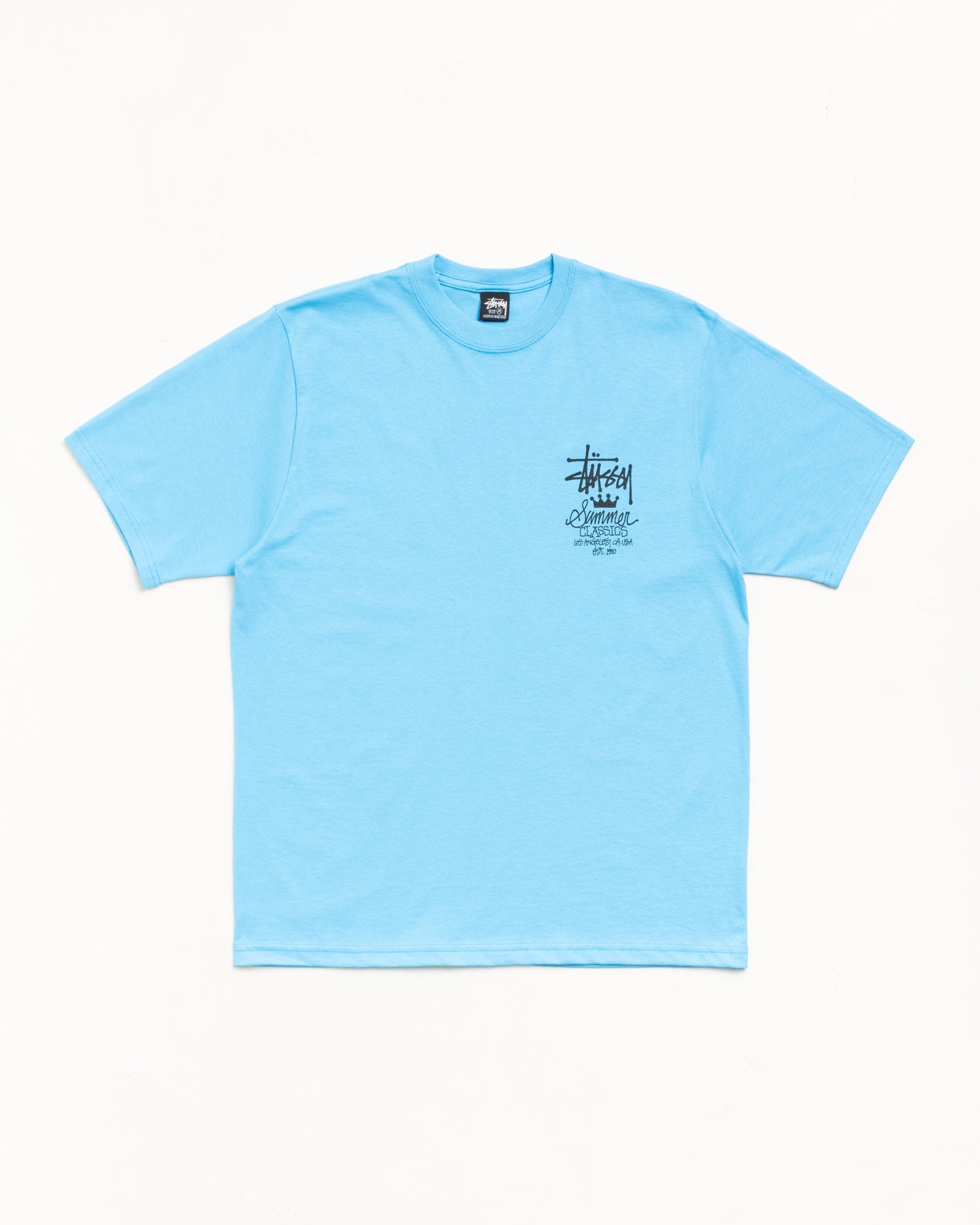 Unisex short sleeve cotton tee in sky blue with small chest graphic