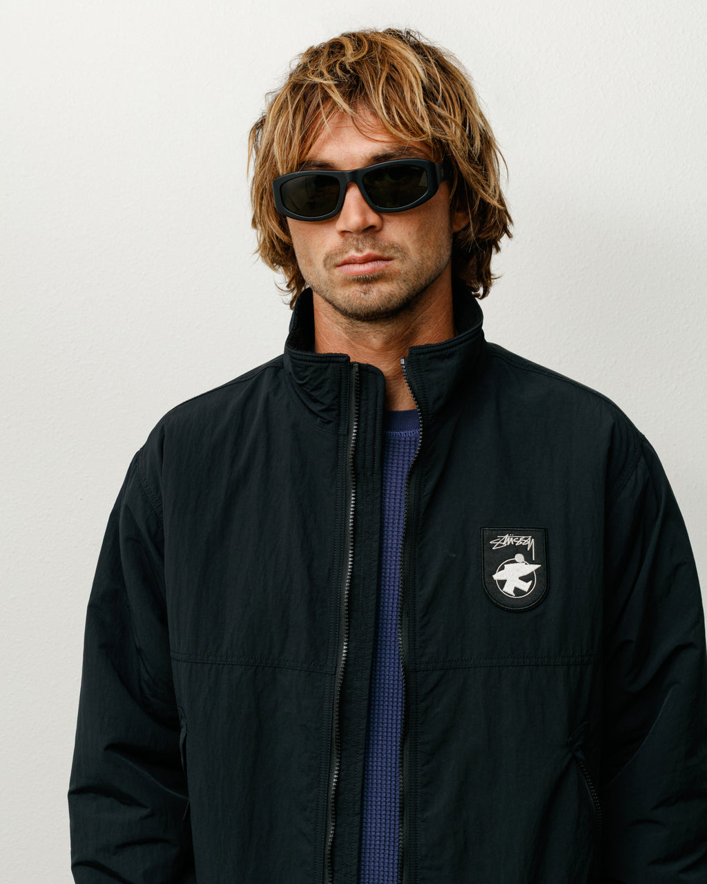 Model wearing the Landon Sunglasses in Black/Black Lens.